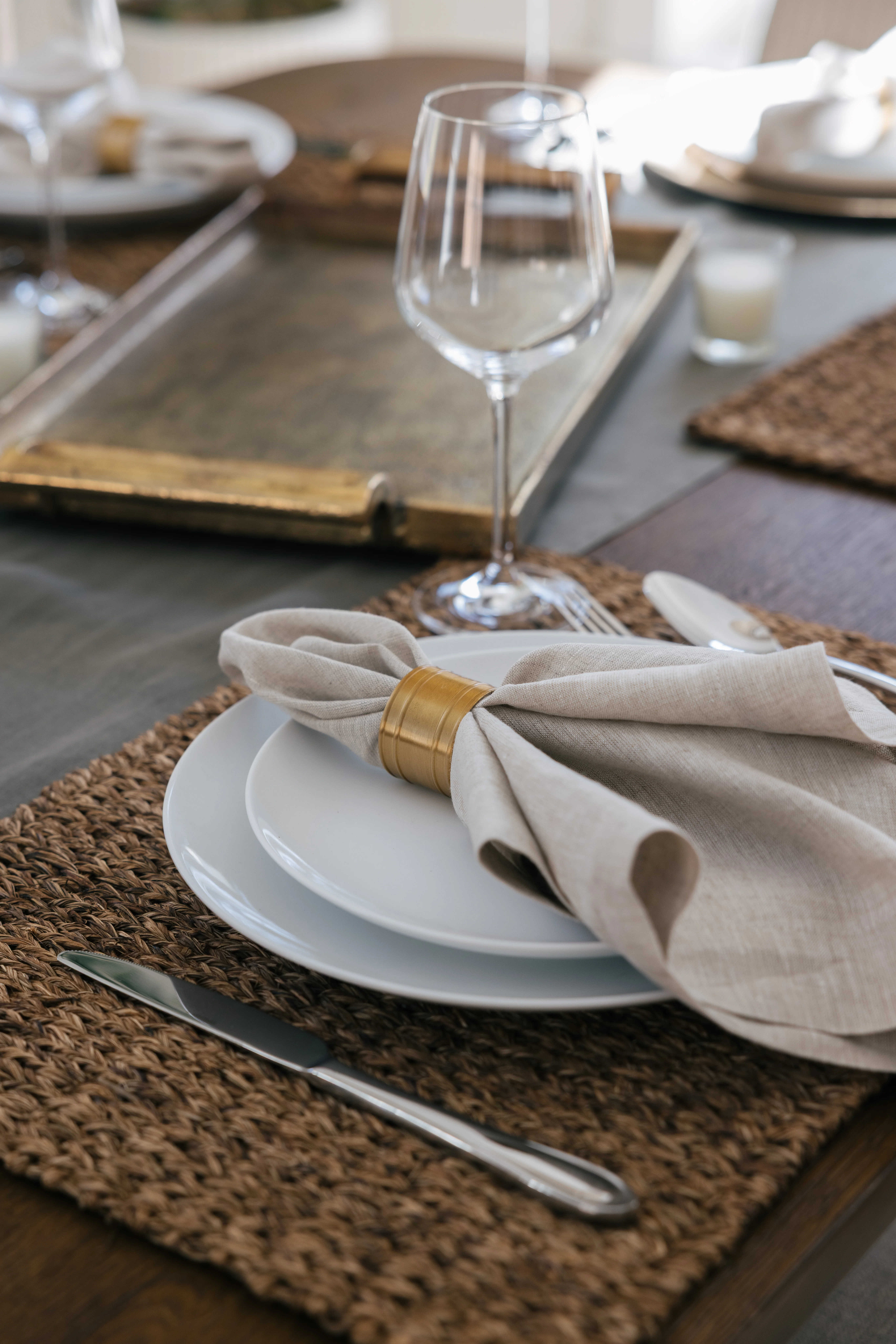 Dining table lifestyle moment with guests enjoying a meal in the open-plan space